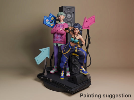Zoey resin figure from KPop Demon Hunters on black base with speaker props, painted in blue outfit with dark hair, posed with male character in pink sweater.