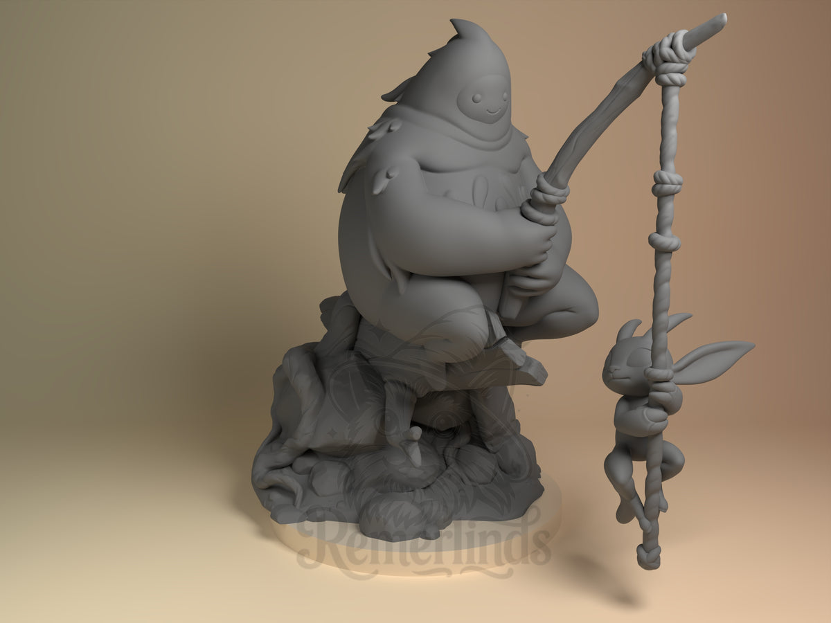Spirit Companions Light of the Lost Forest 3D printed resin Chibi figure by Nomnom, unpainted front view. The 3D printed resin miniature depicts a chibi-style character sitting cross-legged on a detailed natural base while holding a fishing rod. A smaller companion creature, with large ears and closed eyes, dangles from a rope attached to the rod. The character has a rounded, cloaked form with minimal facial features, emphasizing a cute and stylized design.